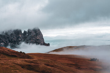 Morning mist over Seiser Alm in the Dolomites, Italy.