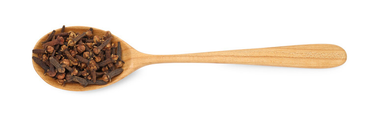 Dry clove buds in wooden spoon on white background, top view. Aromatic spice