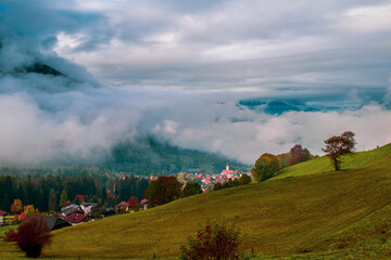 Morning mist over Seiser Alm in the Dolomites, Italy.