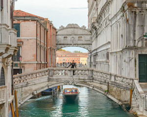 Woman with view bridge of Sighs (Ponte dei Sospiri). Venice, Italy.