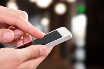 Hand typing on phone for social media