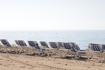 Beach loungers and hammocks. Concept of rest, vacation, good time, family time, rest, enjoyment and fun.