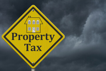  Property Tax warning sign with stormy sky