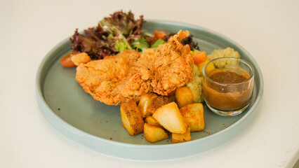 Crispy Chicken Steak, Mix Salad Sauted Mixed Vegetable, Choices of Potatos and Sauce