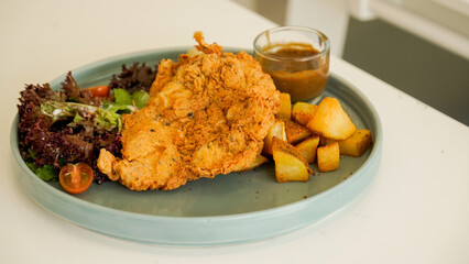 Crispy Chicken Steak, Mix Salad Sauted Mixed Vegetable, Choices of Potatos and Sauce
