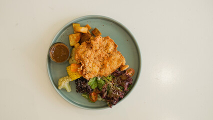 Crispy Chicken Steak, Mix Salad Sauted Mixed Vegetable, Choices of Potatos and Sauce