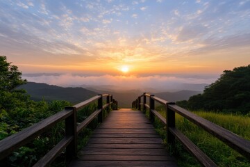 Obraz premium scenic sunrise over mountains with wooden pathway