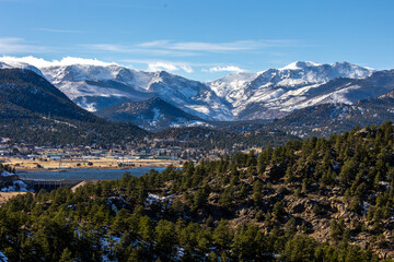 Nestled at the foot of the snow-capped Rocky Mountains, Estes Park, Colorado, shines under a clear...
