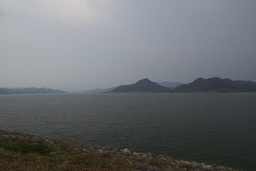 Tranquil water landscape remote mountain lake nature photography serene environment wide-angle view peaceful retreat for mindfulness
