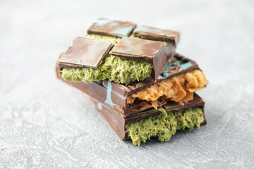 Dubai chocolate  with baklava and caramel, green kataifi and pistachio paste. Trend dessert