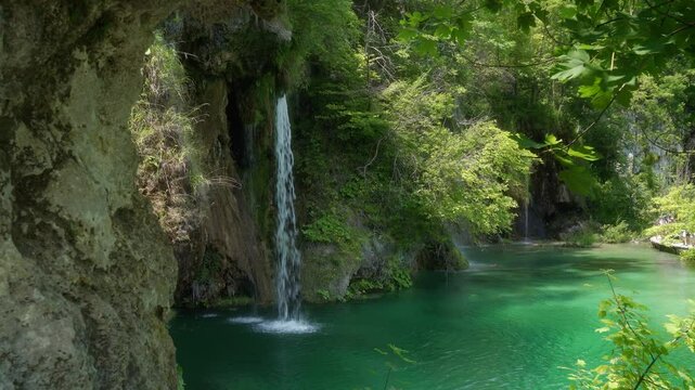 A waterfall with clear water in the famous Croatian Plitvice Lakes National Park, listed as a UNESCO World Heritage site. A popular natural tourist attraction in Croatia.
