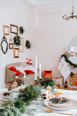 Cozy Christmas dining setting with festive decor and holiday treats indoors