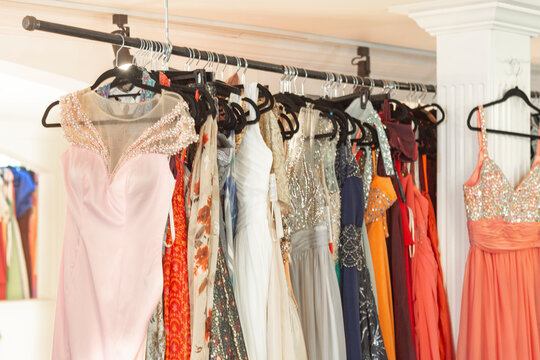 Colorful Evening Wedding Formal Prom Dresses on Retail Store Rack - Powered by Adobe