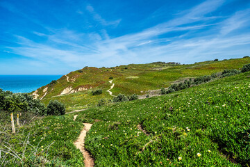 Hiking on the rocky cliffs of Cabo da Roca at the Atlantic coast of Portugal, Europe