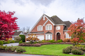 Fragment of  luxury house in fall with green trees and nice landscape in Vancouver, Canada, North America. Day time on November 2024.