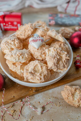 Christmas coconut macaroons on a plate with decoration