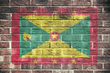 Fototapeta premium Grenada flag on brick wall