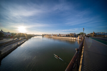 Sunrise Over Guadalquivir River and Triana Bridge in Sevilla