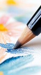 Fototapeta premium a close up of a paintbrush on a piece of paper, with a blurred background The brush is positioned in the center of the paper, and the bristles of the brush are vis