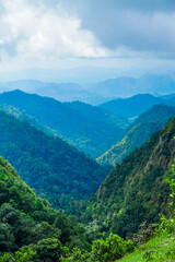 Naklejka premium Breathtaking mountain view lush green valley nature photography scenic landscape wide angle serenity of nature