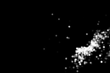 White gray blurred bokeh lights on black background. Glitter sparkle stars for celebrate. Overlay for your design