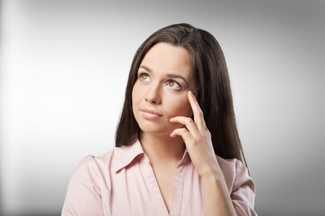 Young woman thinking of ideas planning