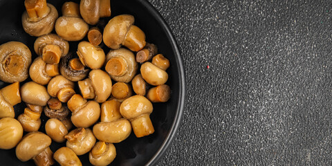 Champignon mushroom canned product tasty food dish fresh delicious gourmet food background on the table rustic food top view copy space top view keto and paleo diet Vegetarian and vegan food