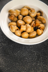 Champignon mushroom canned product tasty food dish fresh delicious gourmet food background on the table rustic food top view copy space top view keto and paleo diet Vegetarian and vegan food