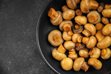 Champignon mushroom canned product tasty food dish fresh delicious gourmet food background on the table rustic food top view copy space top view keto and paleo diet Vegetarian and vegan food