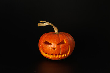 Pumpkin on black background. Halloween holiday concept