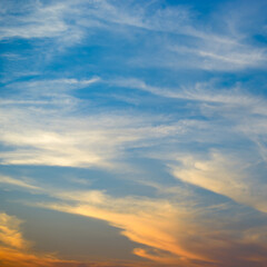 Bright orange sun against blue sky.