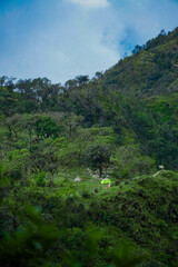 Obraz premium Camping adventure in serene mountain landscape nature retreat outdoor experience tranquil environment aerial view escape to nature