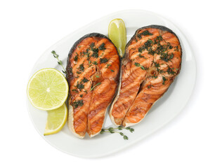 Tasty grilled salmon steaks with thyme, dill and lime isolated on white, top view