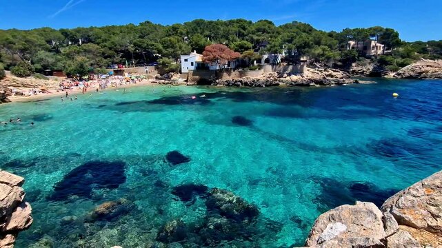 Cala Gat Mallorca Majorca Spain 4k video of turquoise crystal sea small beach. panoramic view of cozy rocky bay cove destination balearic island summer vacation b-roll establishing