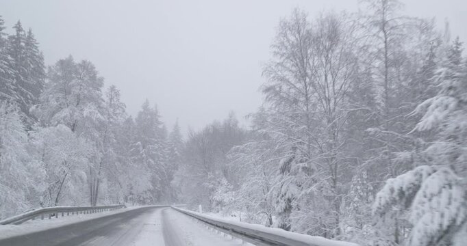 Winter Driving - Driving on a curvy mountain road -  POV shot / Front view driving plate