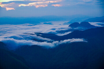 Breathtaking sunrise over misty mountains nature landscape cloudscape scenic view tranquil environment adventure experience
