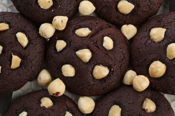 Tasty chocolate cookies with hazelnuts, closeup view