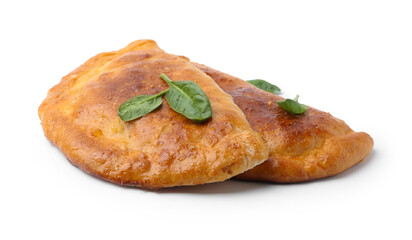Tasty calzones with basil isolated on white