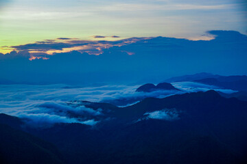Breathtaking sunrise over misty mountains nature landscape cloud cover high altitude serene viewpoint tranquil beauty for nature enthusiasts
