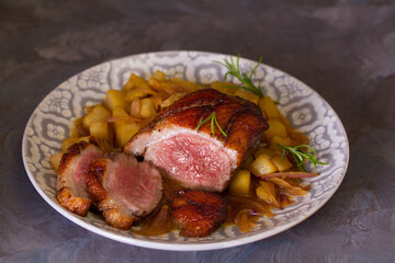 Duck breast fillets with pears and rosemary