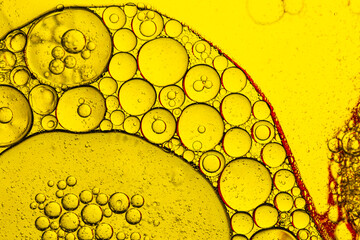 Macro yellow drink bubble texture,water drops on a yellow background,Yellow fat, like obesity...