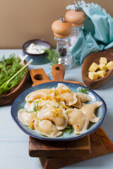 Dumplings filled with mashed potatoes. Varenyky, vareniki, pierogi, pyrohy - dumplings with filling