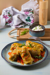 Stuffed cabbage leaves. Cabbage wraps. Chou farci, dolma, sarma, golubtsy or golabki. Flat lay, layout, overhead