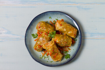 Stuffed cabbage leaves. Cabbage wraps. Chou farci, dolma, sarma, golubtsy or golabki. View from above, top studio shot