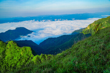 Breathtaking sunrise over misty mountain peaks nature landscape scenic viewpoint tranquil environment adventure spirit