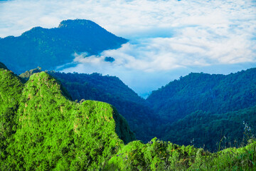 Breathtaking sunrise over lush mountains nature landscape cloudy atmosphere high perspective serenity and tranquility