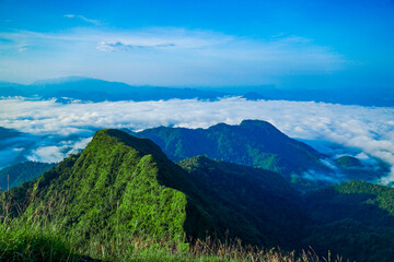 Naklejka premium Breathtaking mountain landscape cloudy valley nature photography scenic view tranquil atmosphere adventure inspiration
