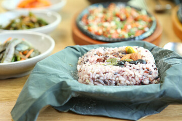 rice and nuts wrapped in lotus leaves