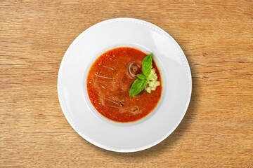 A bowl of creamy tasty fresh soup on the desk