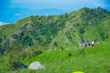 Camping adventure scenic mountain range outdoor event lush green environment aerial view nature exploration